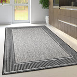 Grey non-slip flat weave rug with dark border - view 1
